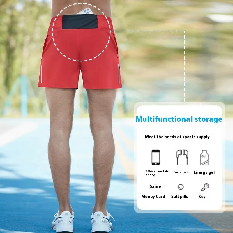 Man wearing high-waisted, loose-fit black off-road running shorts for marathon training.