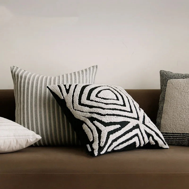 Black and white geometric towel embroidery cushion in 50x50cm square and 30x50cm waist pillow formats for sofa and living room.