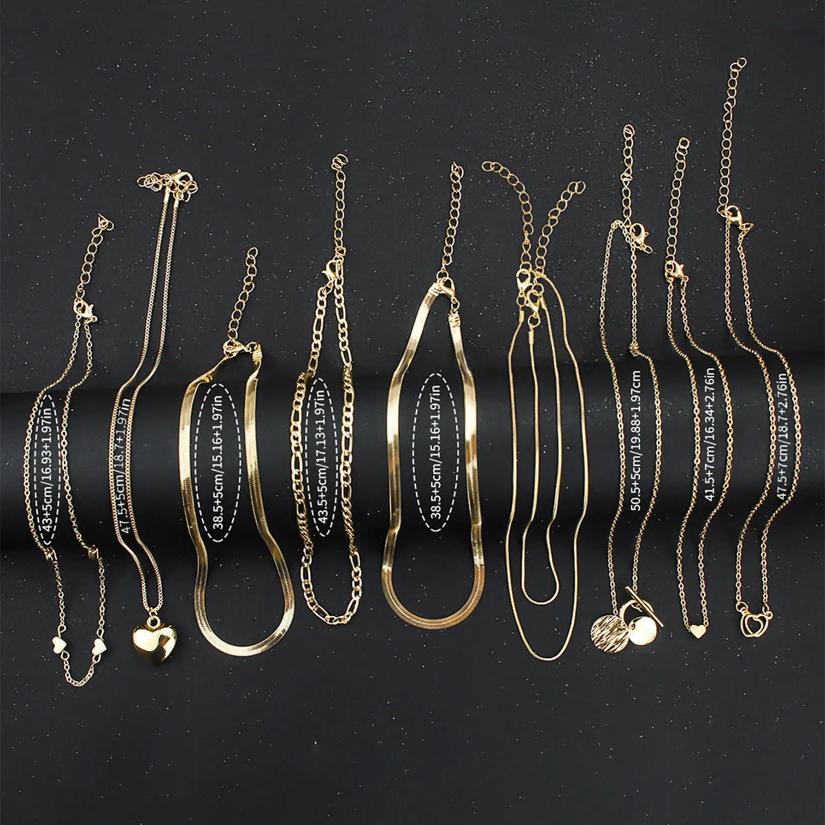 10-piece women's gold necklace set with snake bone chain and alloy pendants