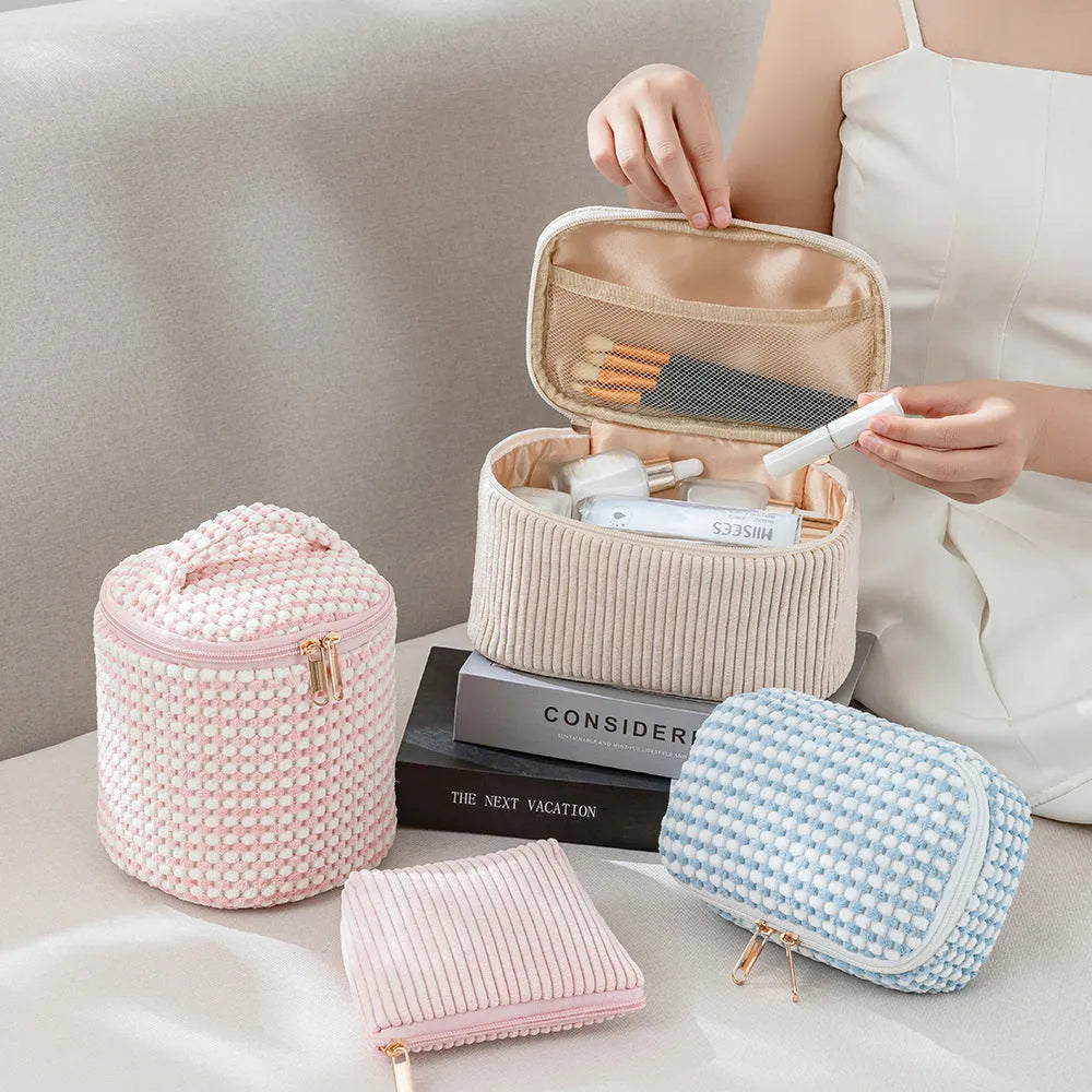 Four cube-style flannelette makeup bags in a set, shown in blue with dots colour.
