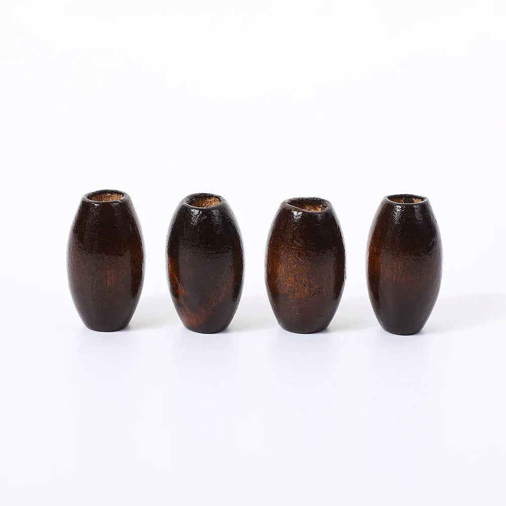 Dark coffee coloured oval wooden bead with M-shape profile, showing 6mm hole.