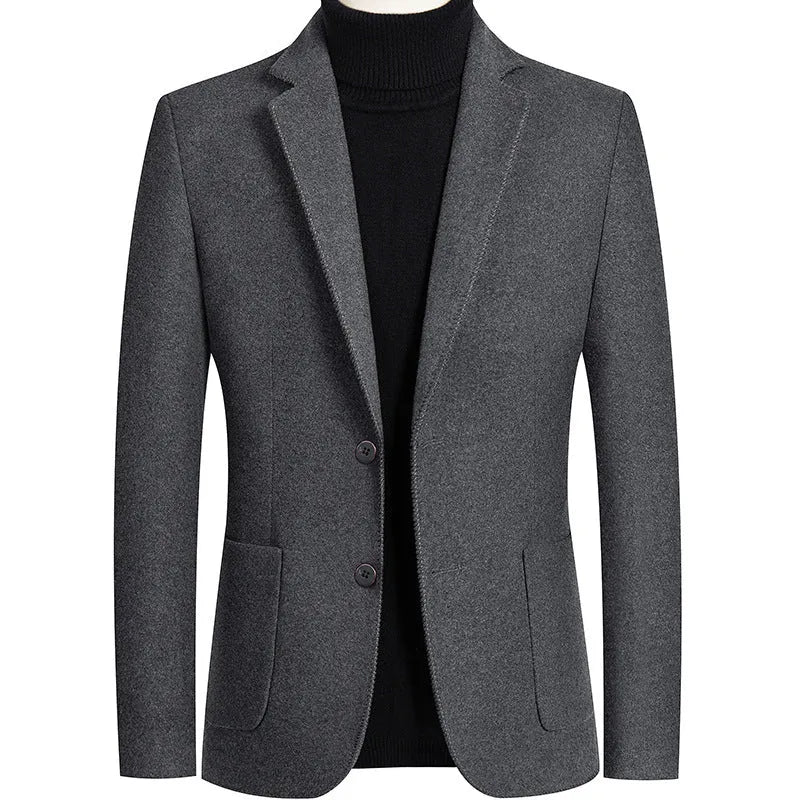 Men's slim fit wool suit jacket in grey, shown on a model, suitable for autumn and winter.