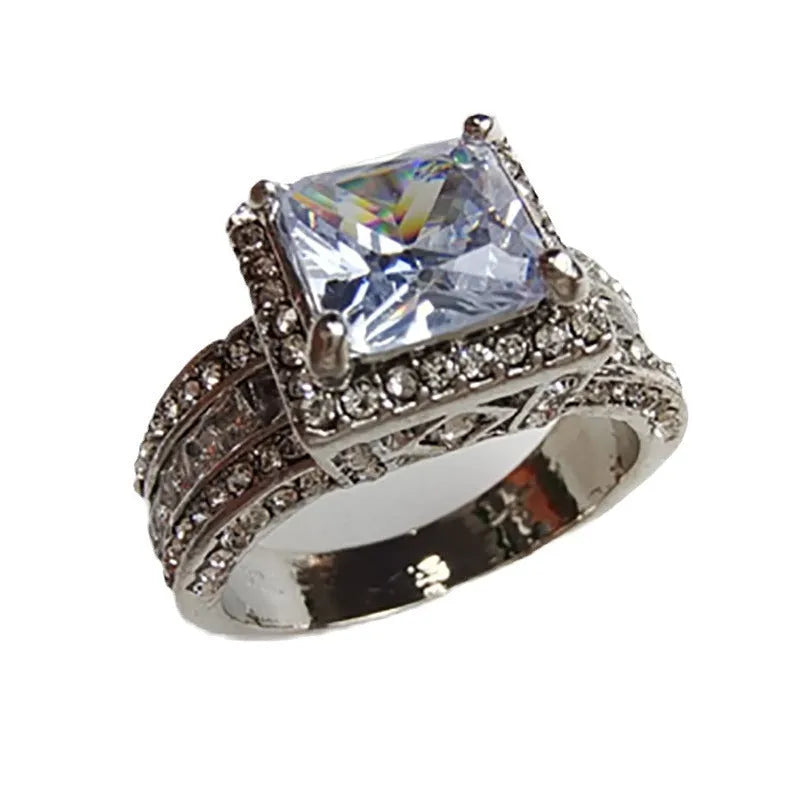 Geometric sweet and cool style alloy ring in gold or white electroplated finish.