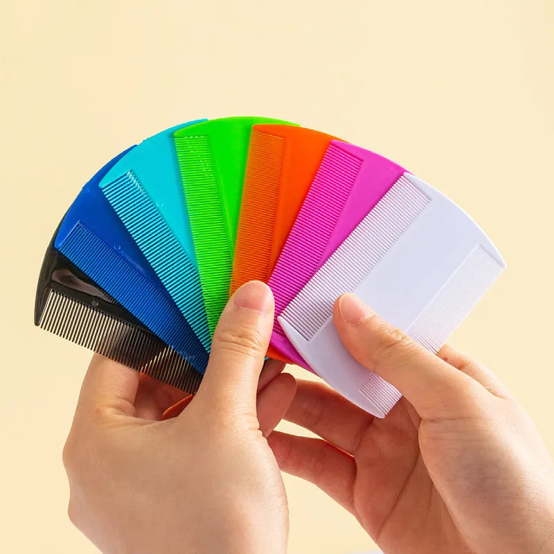 A white plastic double-sided fine-toothed flea comb for pets and humans.