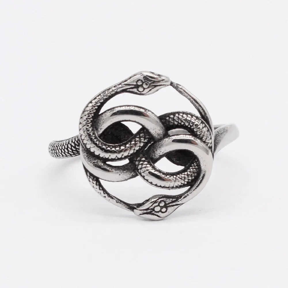A titanium steel men's snake ring in steel colour showing a detailed twisted retro design on a finger.