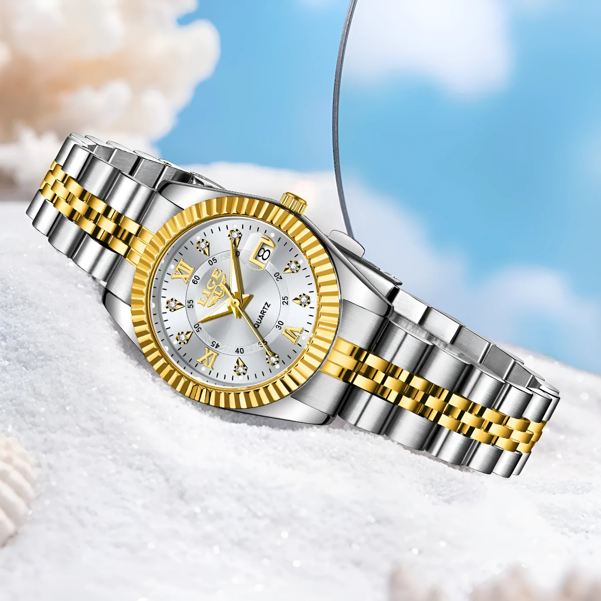Women's waterproof quartz watch in gold and silver colours with 10mm thickness.