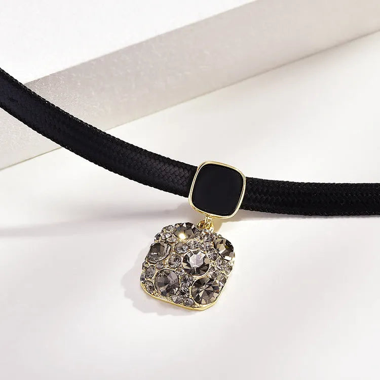 Alloy short necklace with grey diamond square pendant, black rhimestone accents, and adjustable 21-50cm chain on white background