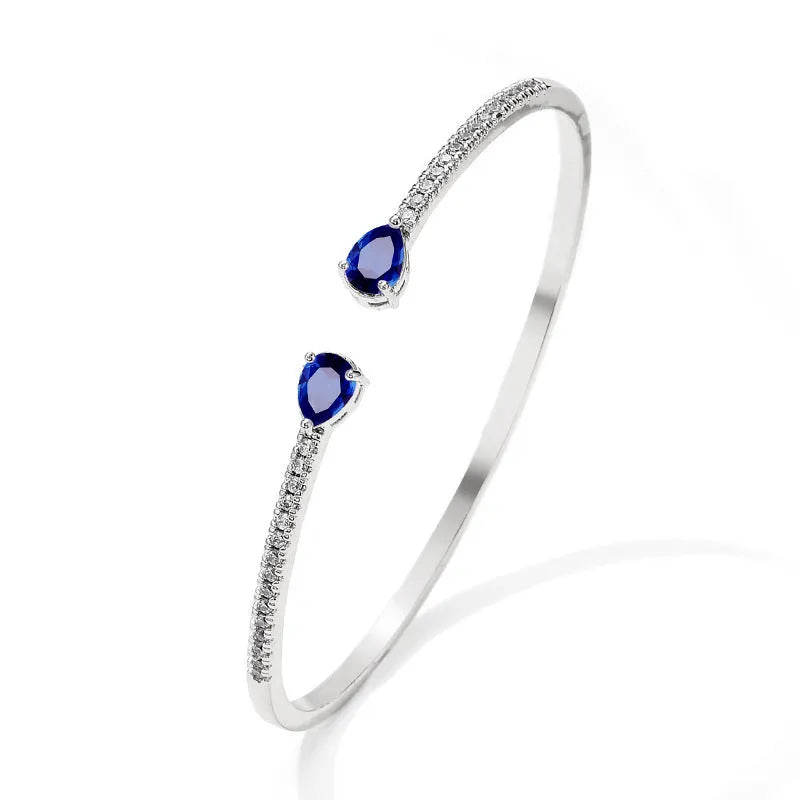 Multi-zircon bracelet with inlaid design on copper material in white or blue colour