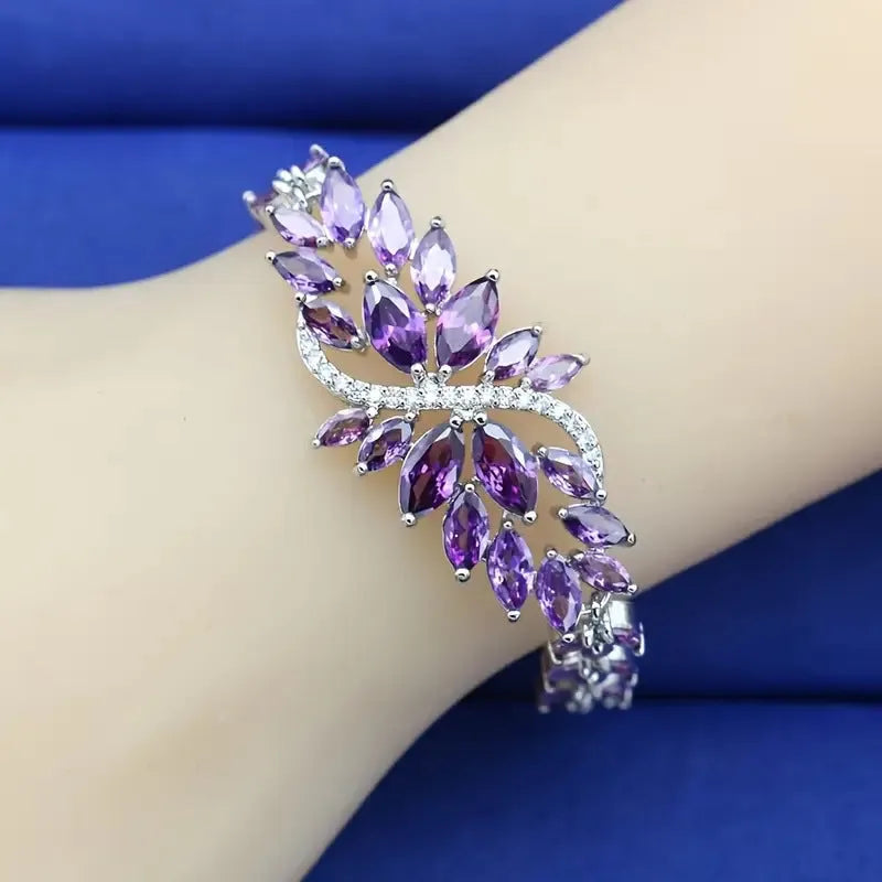 Copper bracelet with gold electroplating and coloured zircon stones in ice flower pattern design