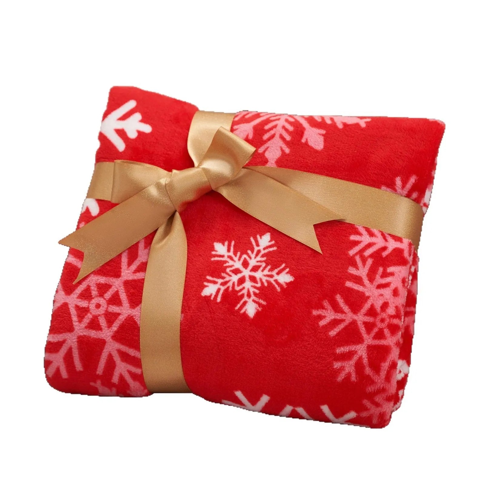 Soft red plush Christmas blanket draped over a sofa, showing its textured flannel material.