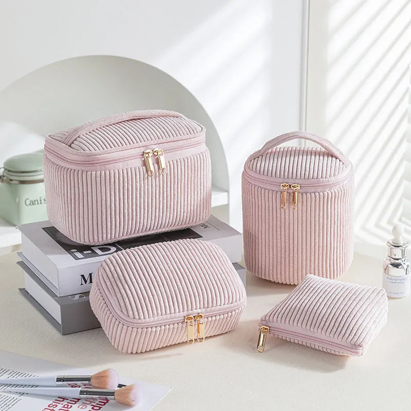 Four cube-style flannelette makeup bags in a set, shown in blue with dots colour.