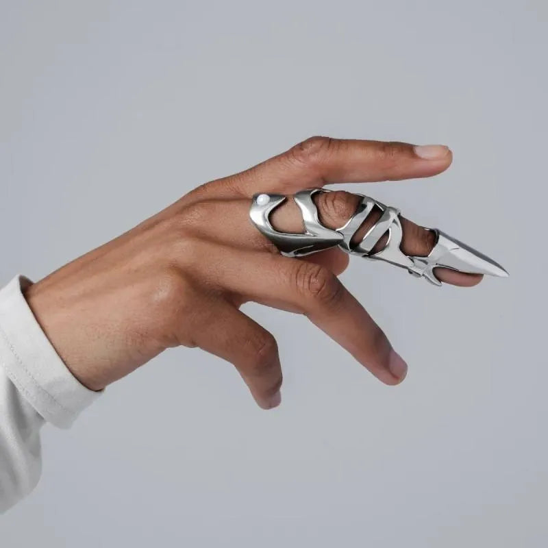 Silver-coloured punk armour finger stall fashion ring made from alloy.