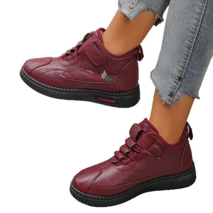 Women's black velvet house shoes with non-slip rubber sole and hollow-out decorative elements