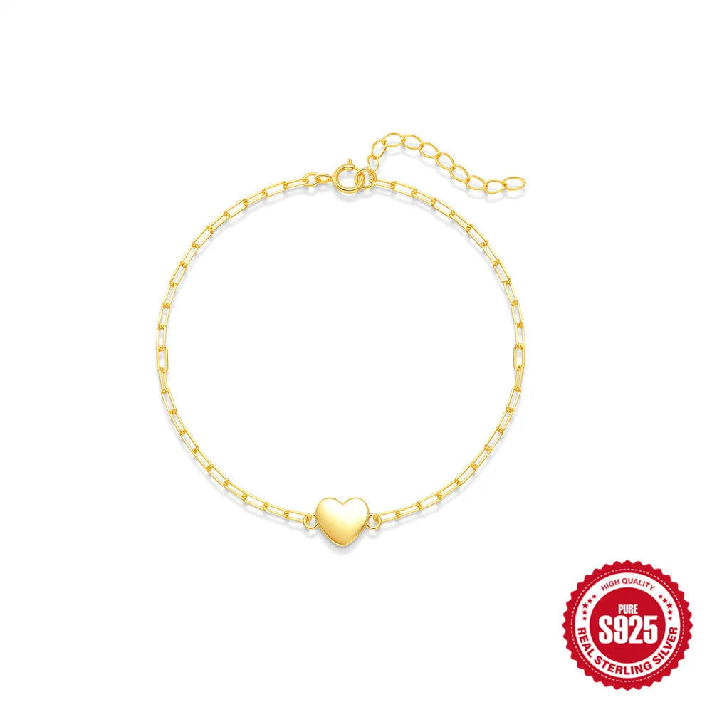 Gold tone S925 sterling silver bracelet with heart charm and clip chain closure