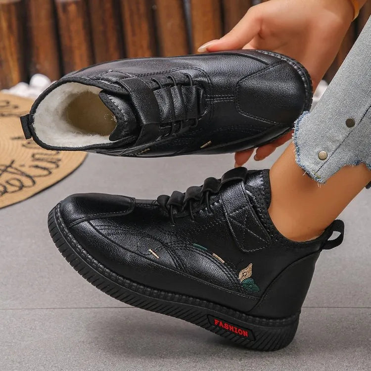 Women's black velvet house shoes with non-slip rubber sole and hollow-out decorative elements