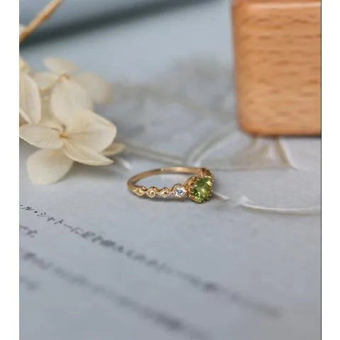 Copper women's ring with a Japanese-style geometric quadrilateral design on a hand.