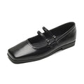 Women's silver leather ballet flats with a cross buckle strap and round toe.