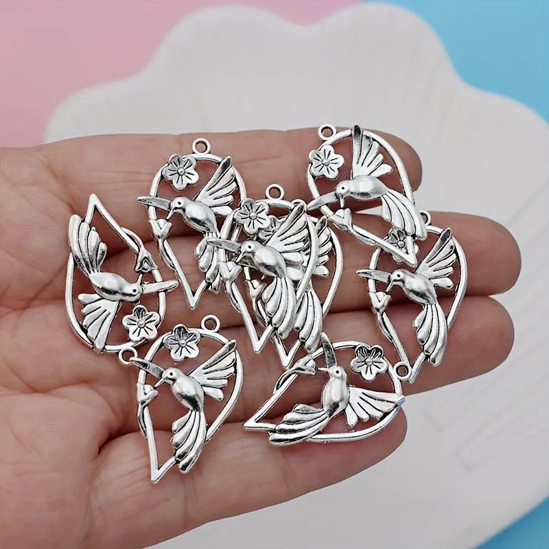 Alloy flying magpie bird pendant with electroplated finish in colour P234 for DIY jewellery.