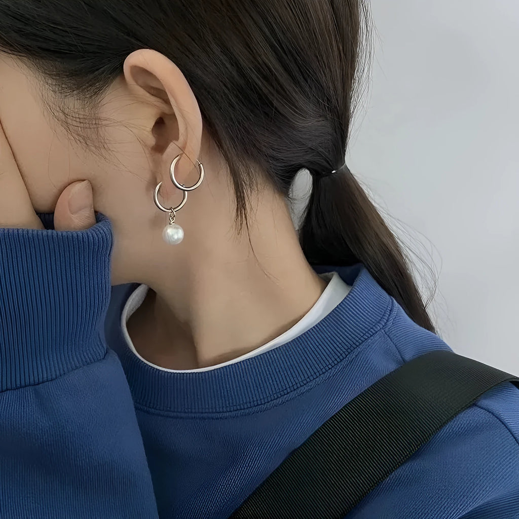 Women's geometric pearl earrings with round elements and titanium steel alloy construction