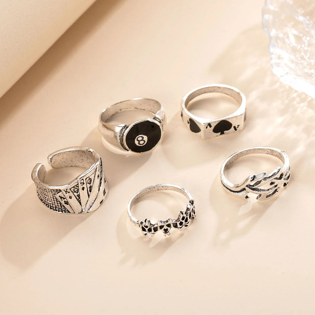 Black alloy ring with a raised retro spade card design on its face.