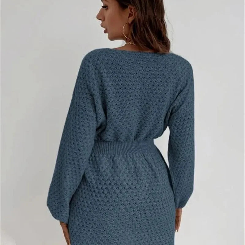 Blue women's knitted dress with fitted waist, crocheted flower details, and French round neckline