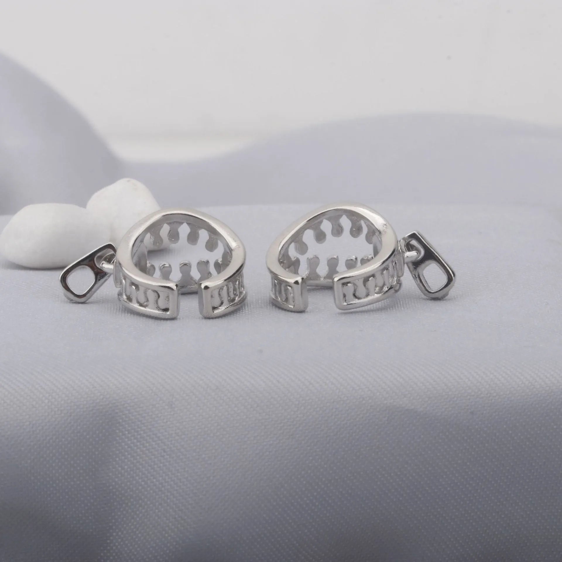 Copper geometric earrings with zipper clip fastening in ES862 colour showing line detail design