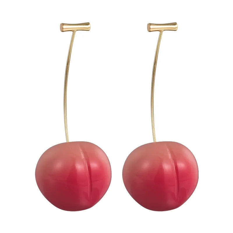 A pair of acrylic peach fruit earrings on a copper post, showing small and large size options.