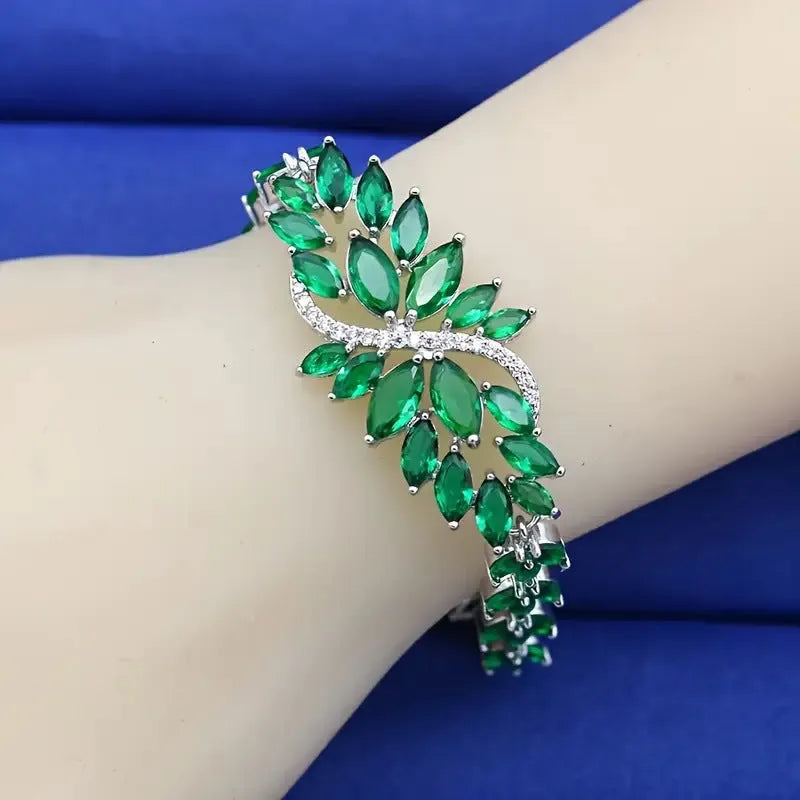 Copper bracelet with gold electroplating and coloured zircon stones in ice flower pattern design