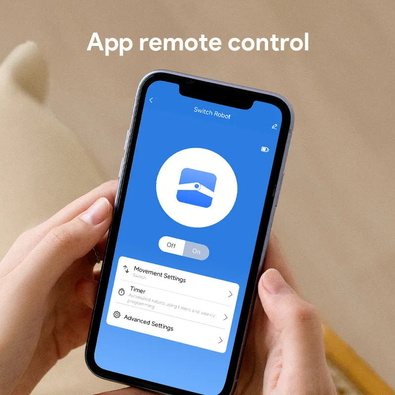 Small white Bluetooth rocker arm finger robot remote control on a surface.