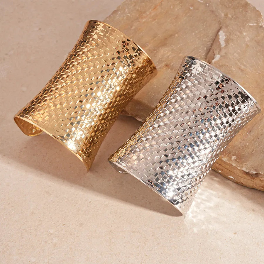 Women's vintage exaggerated metal bracelet in gold or silver colour with round design elements.