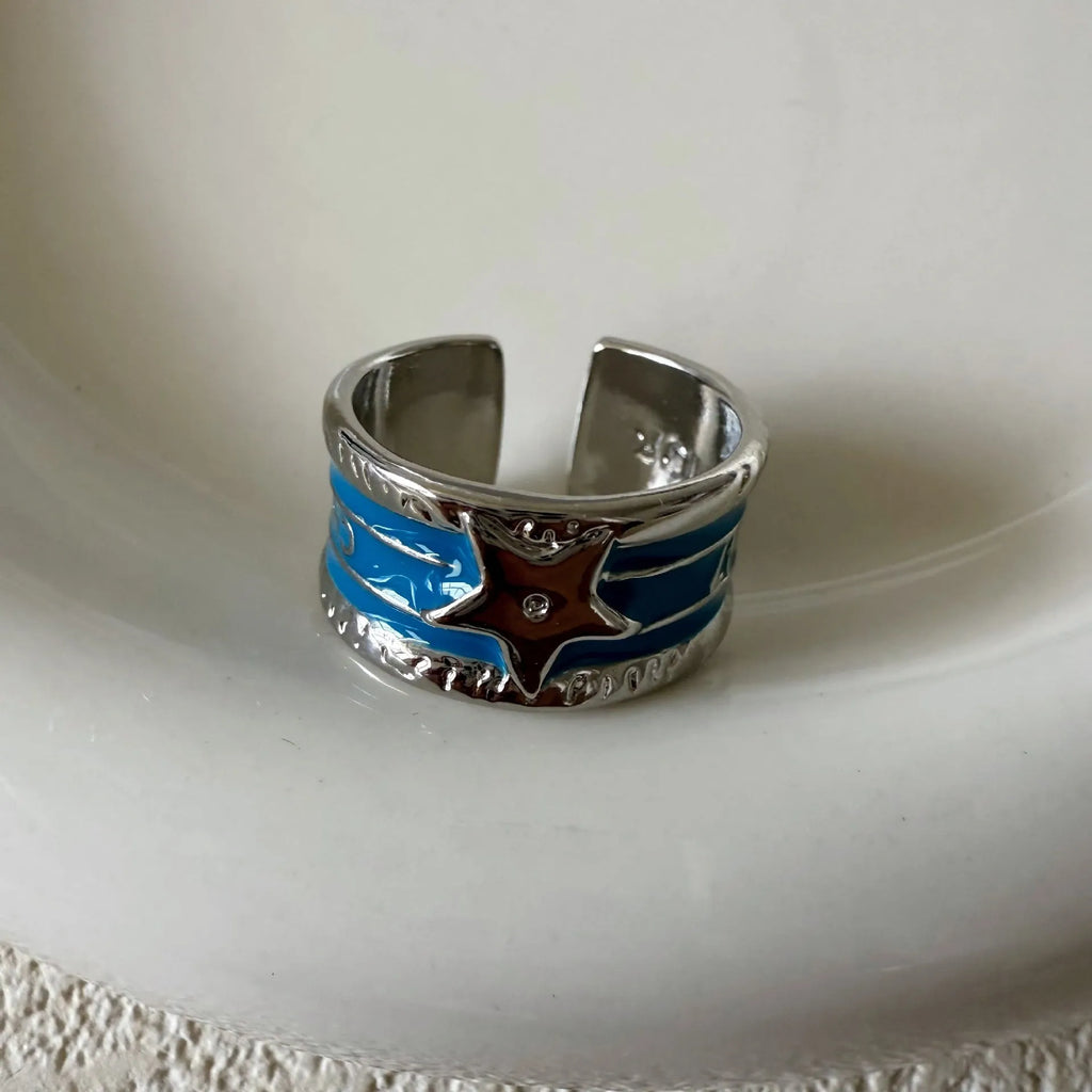 Adjustable copper ring with a geometry shape, distressed finish, and linear design details.