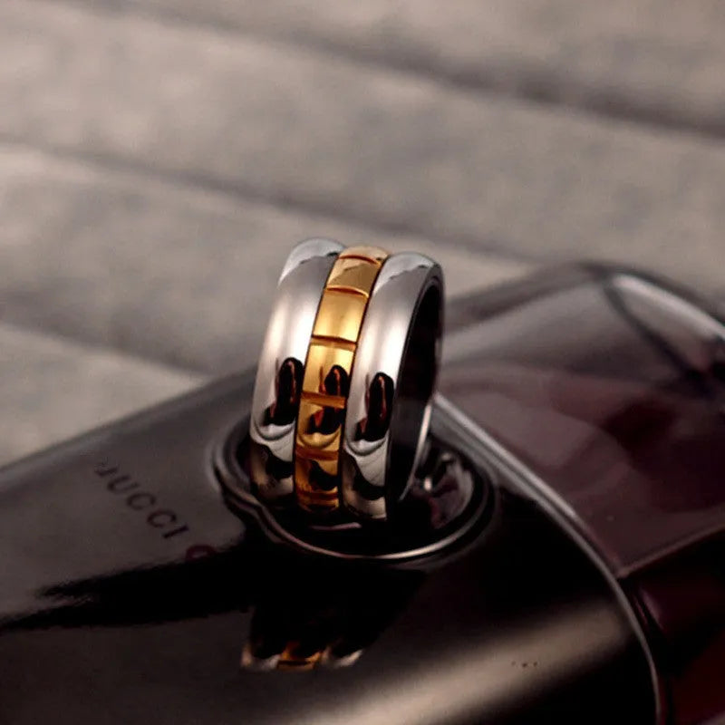 Gold titanium steel ultra-wide knuckle ring with rotatable band on finger
