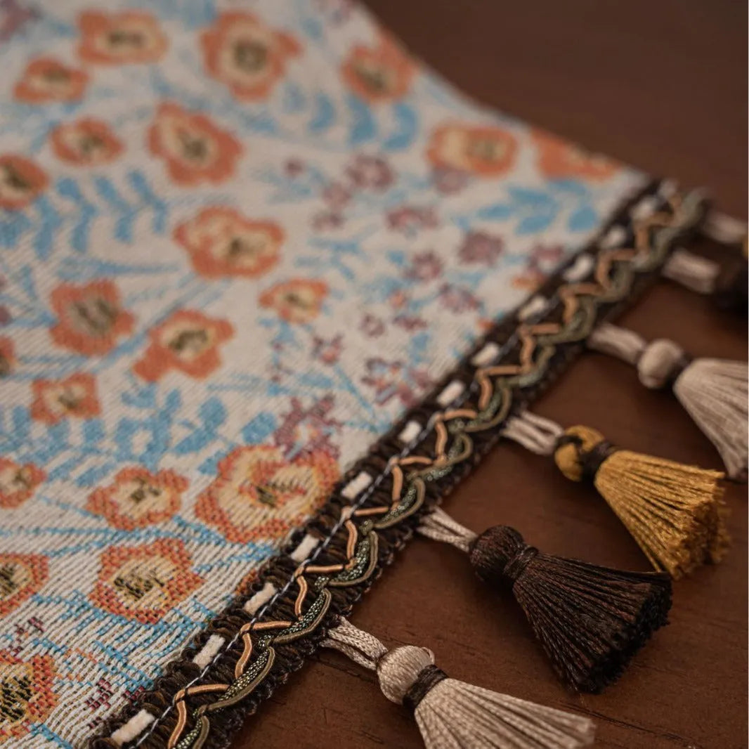 American-style long tassel table runner with Jacquard floral pattern on a table