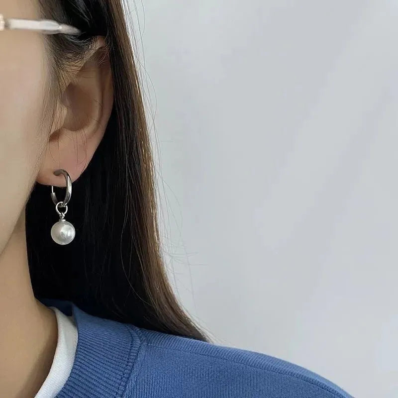 Women's geometric pearl earrings with round elements and titanium steel alloy construction