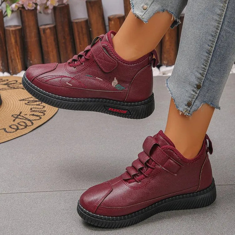 Women's black velvet house shoes with non-slip rubber sole and hollow-out decorative elements