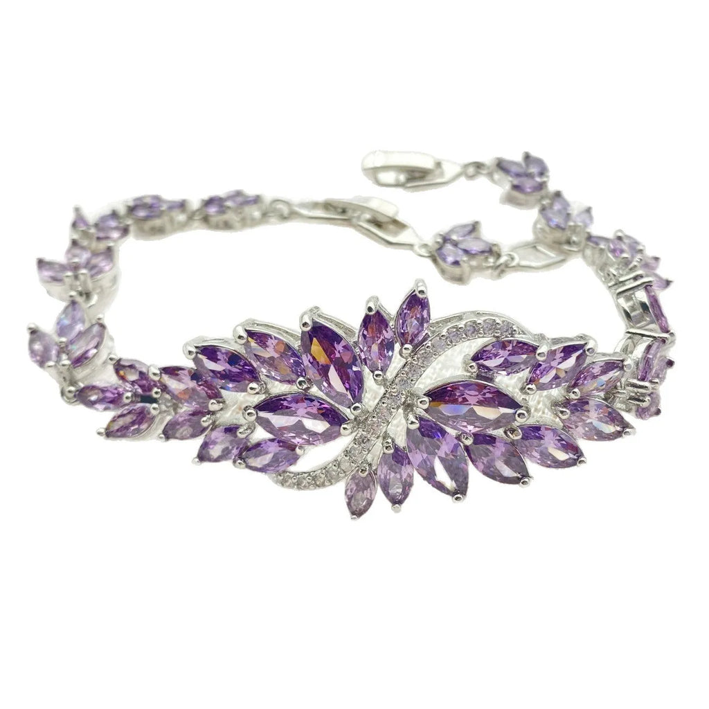 Copper bracelet with gold electroplating and coloured zircon stones in ice flower pattern design
