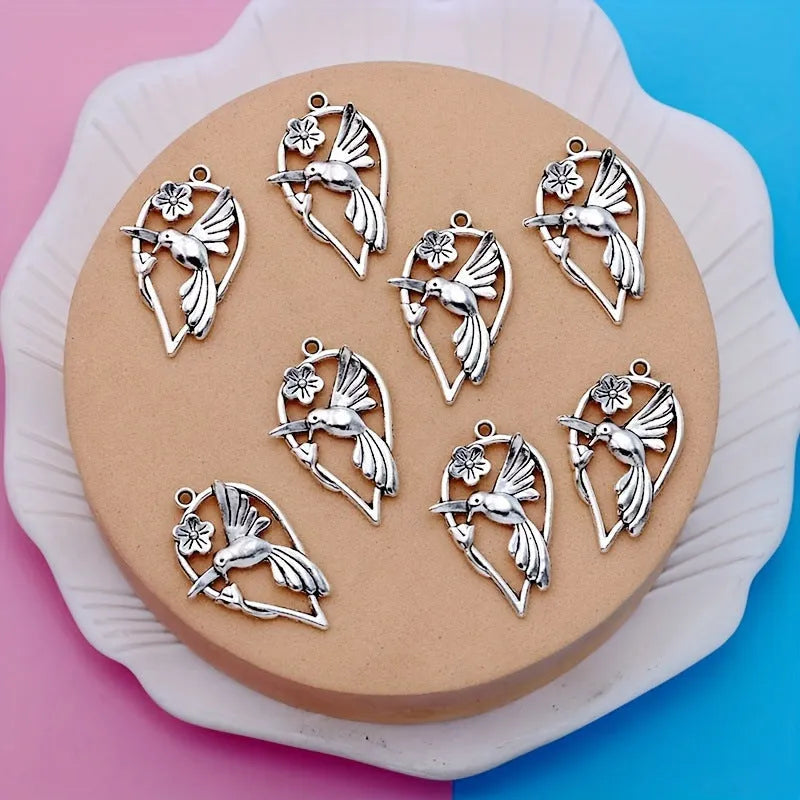 Alloy flying magpie bird pendant with electroplated finish in colour P234 for DIY jewellery.