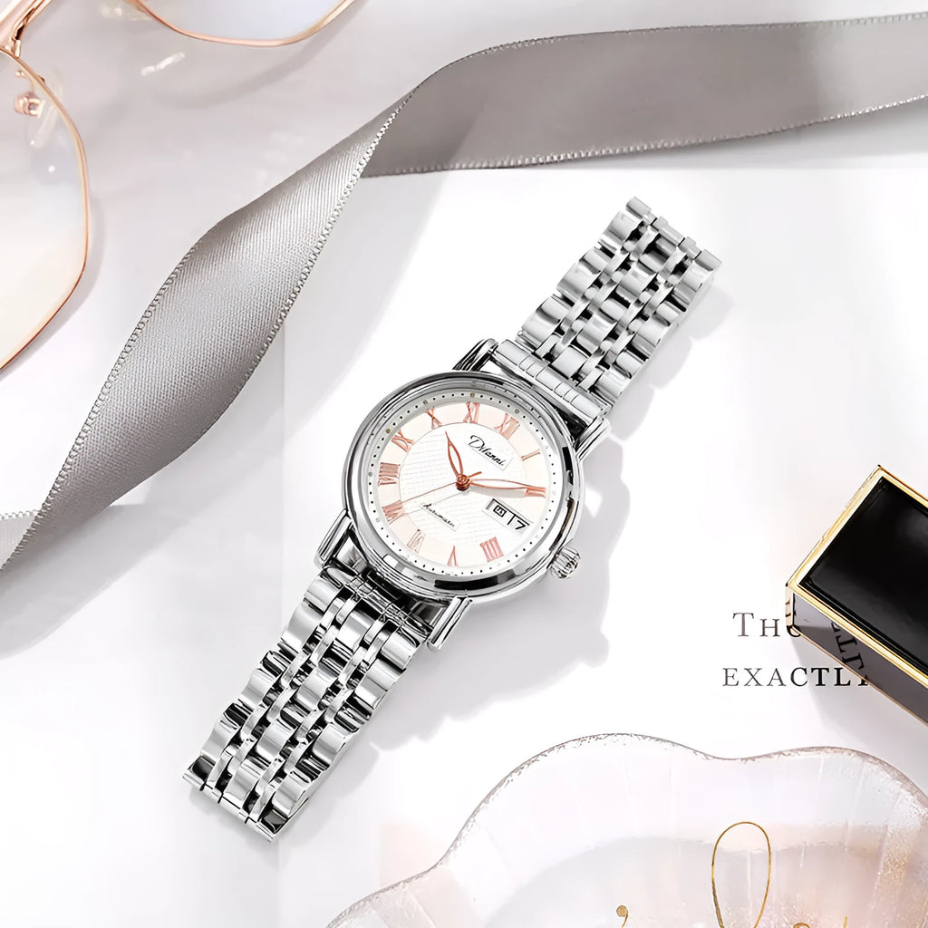 Automatic women's watch with 12mm case on a stainless steel bracelet alongside leather strap options