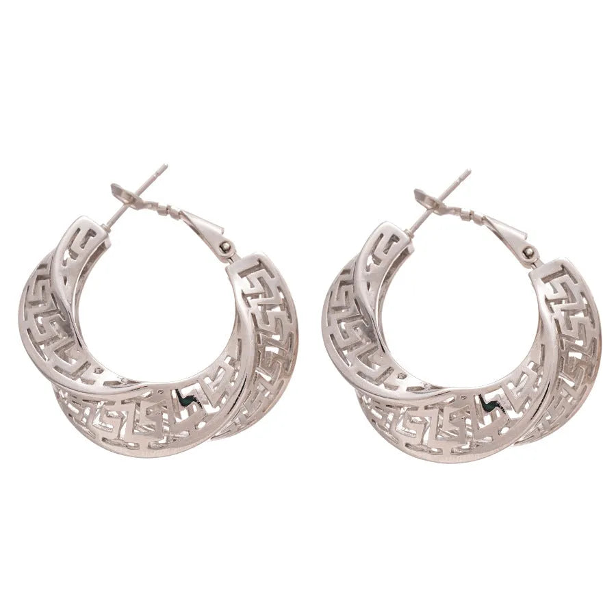 A pair of twisted round geometric hollow stud earrings in a silver electroplated finish.