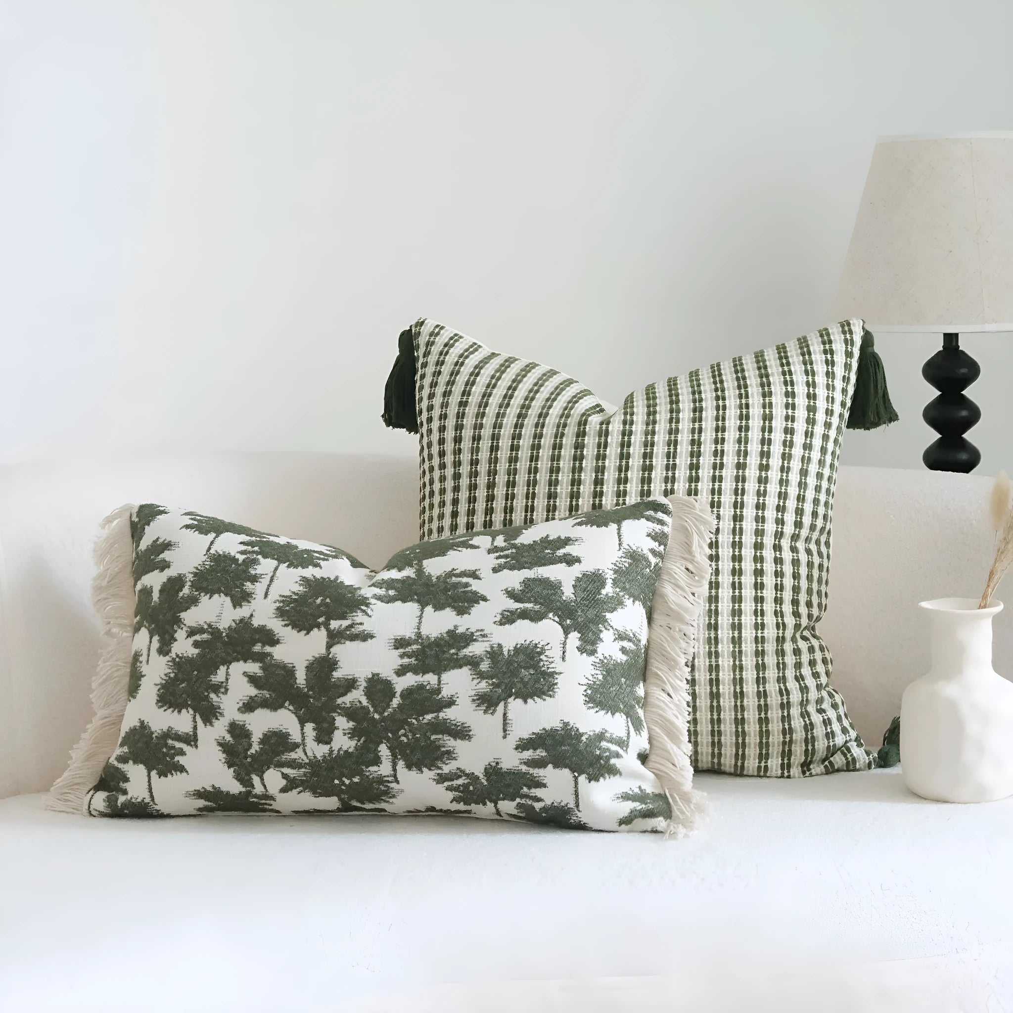 Green decorative hotel pillow set with striped and leafy patterns, shown with a matching pillow core.