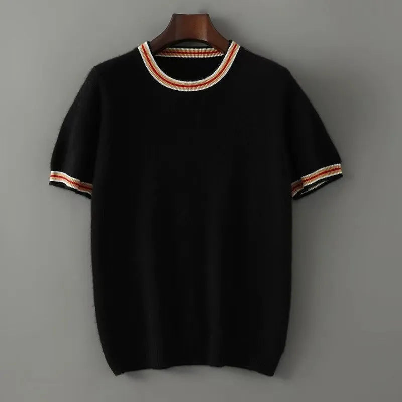 Men's short sleeve pure wool sweater in round neck pullover style on a grey background.