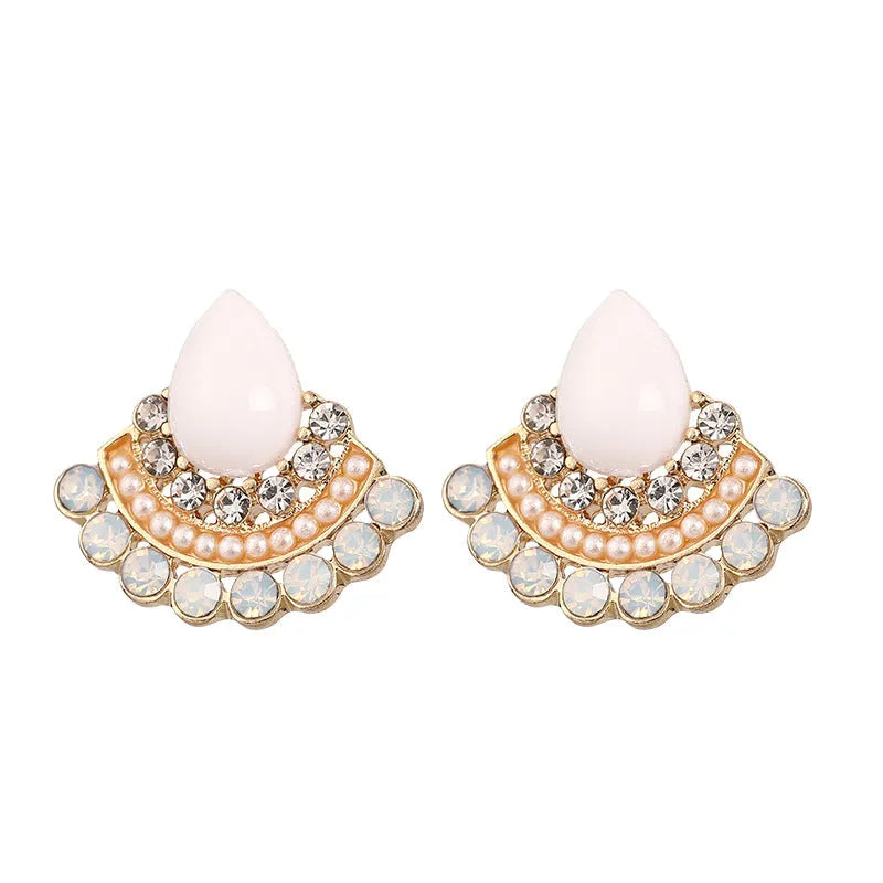 Women's silver retro fan-shaped earrings with opal and rhinestone details on a white background.