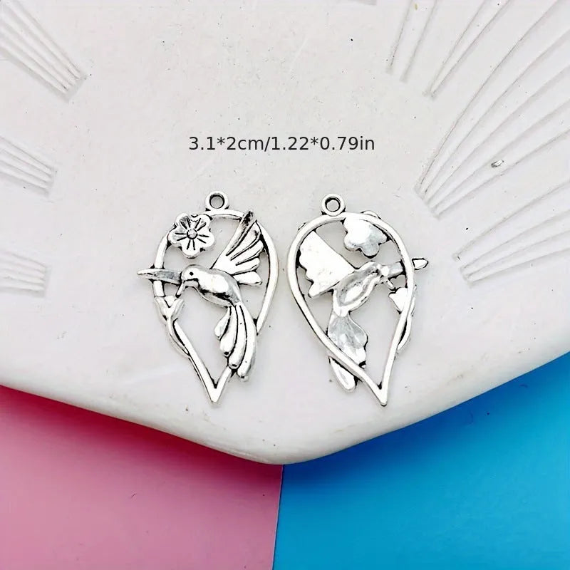 Alloy flying magpie bird pendant with electroplated finish in colour P234 for DIY jewellery.