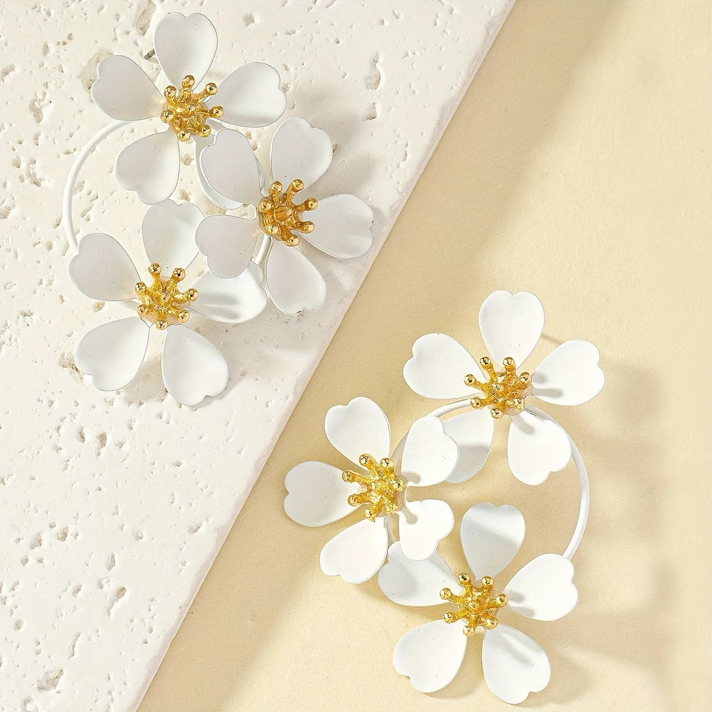 A pair of retro-style flower earrings for women, made from iron with a baking varnish finish in black and white options.