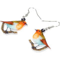 Acrylic geometric pendant earrings with a printed blue titmouse and snake chain design.
