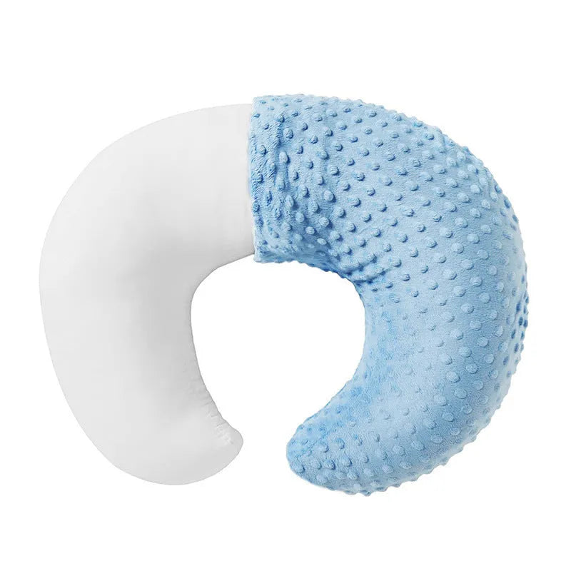 Grey multifunctional nursing pillow with milk spill prevention design on a neutral background