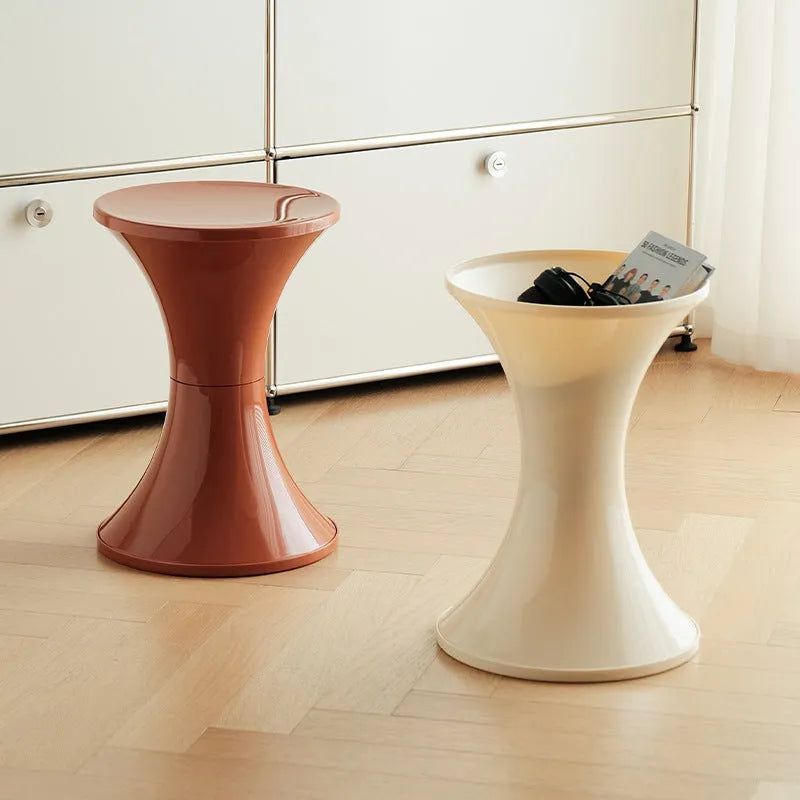 A plastic hourglass-style shoe changing stool shown in one of five available colours: black, green, red, white, or brown.