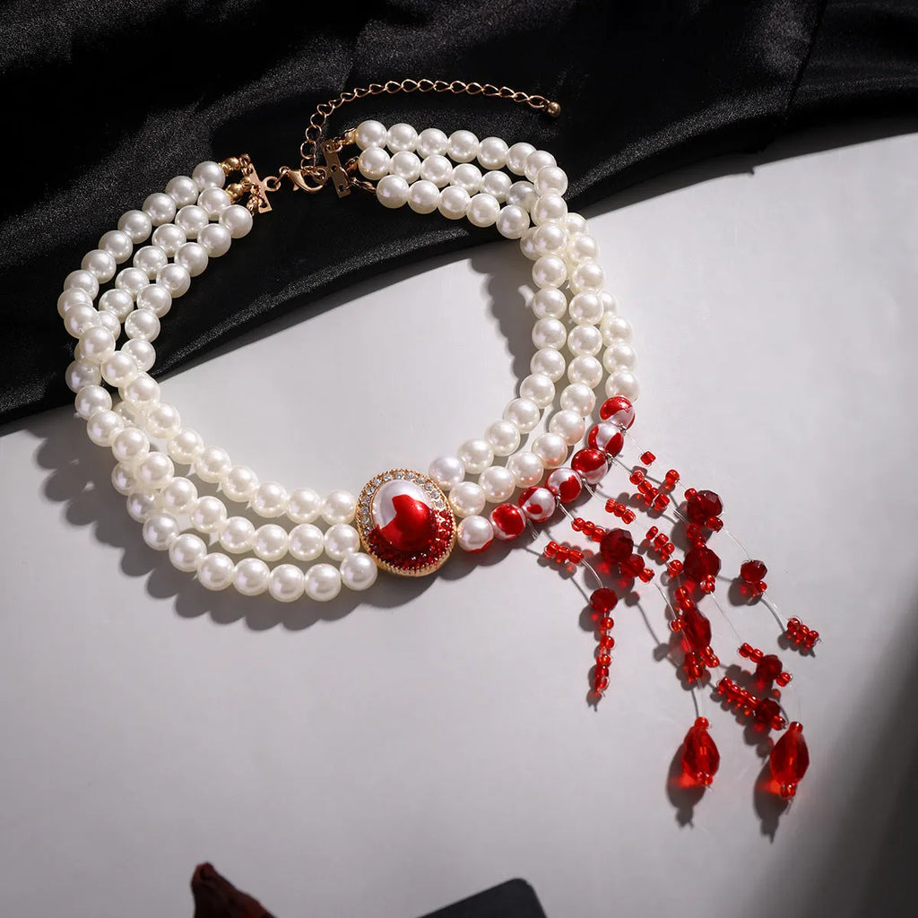 Halloween jewellery set with pearl collar necklace, matching bracelet and gold stud earrings