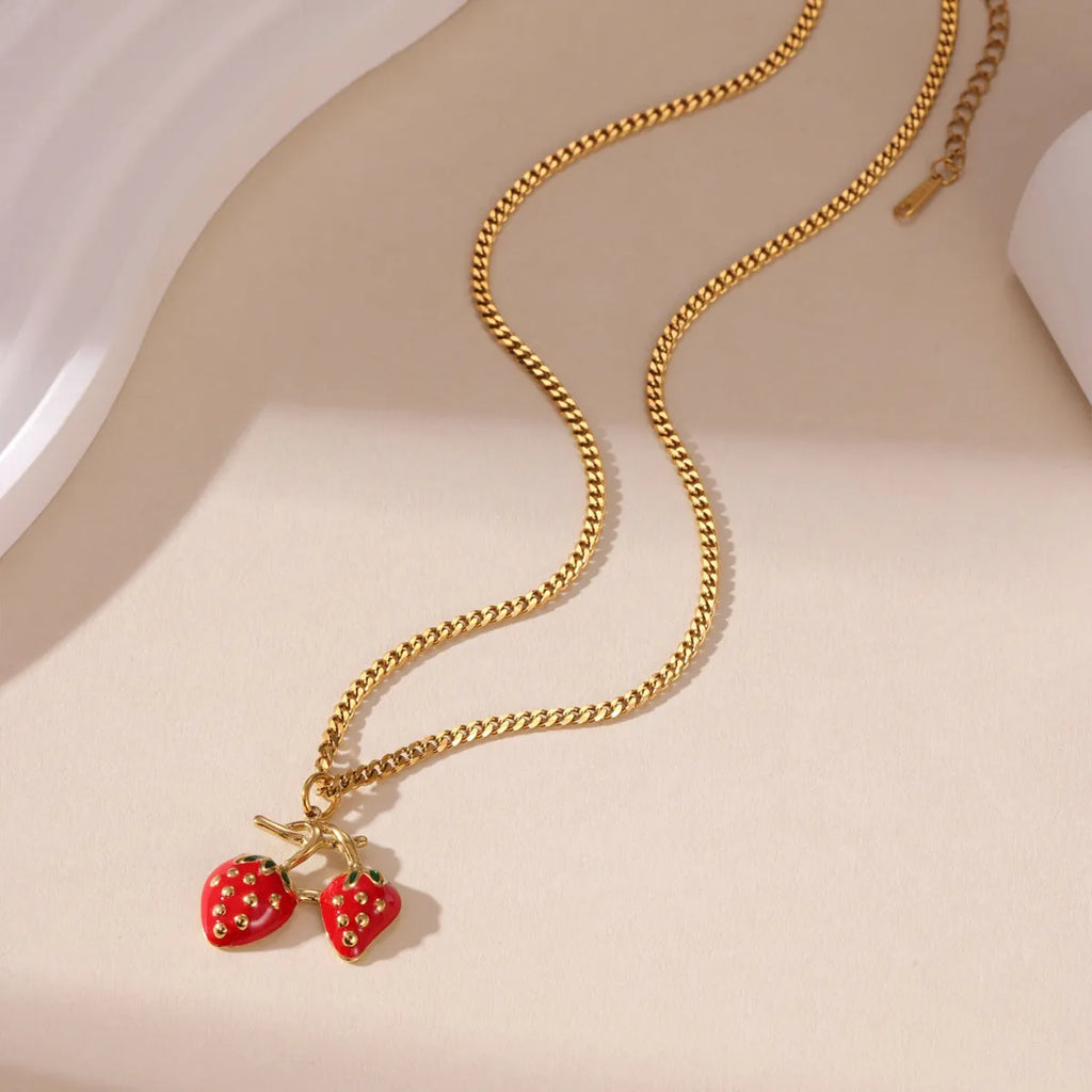 Stainless steel necklace with a strawberry fruit pendant in red or white gradient colour.