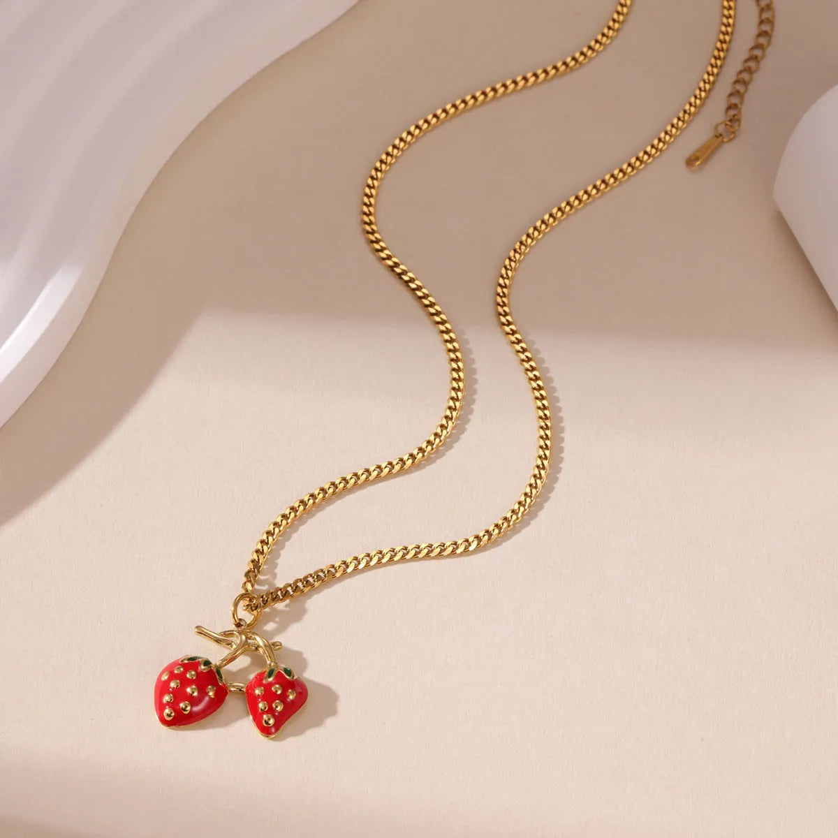 Stainless steel necklace with a strawberry fruit pendant in red or white gradient colour.